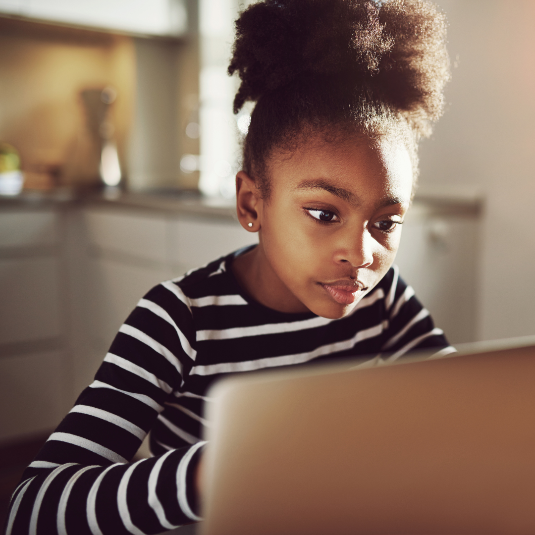 Young black girl at computer